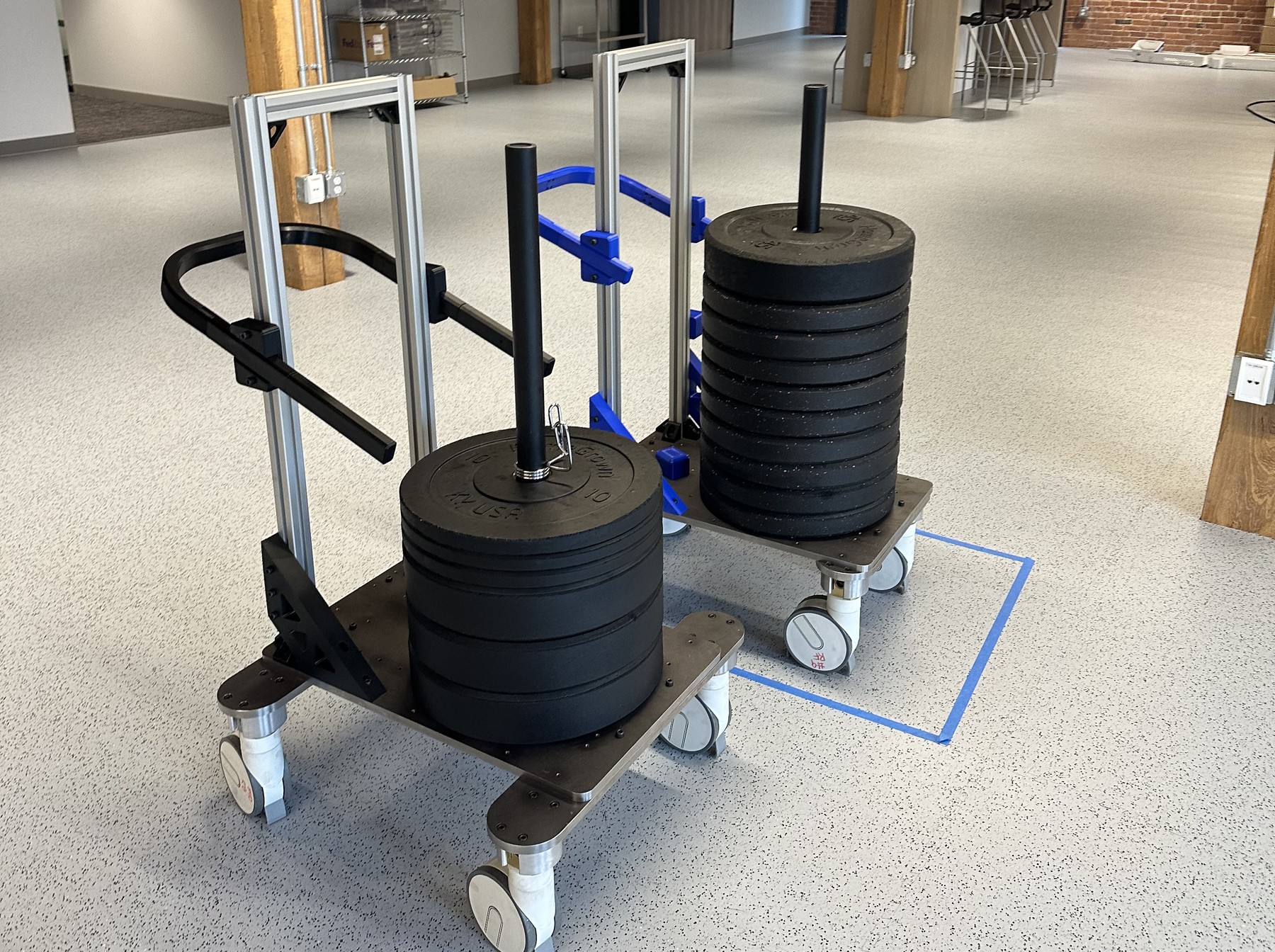The mass simulation cart loaded with two stacks of barbell weights